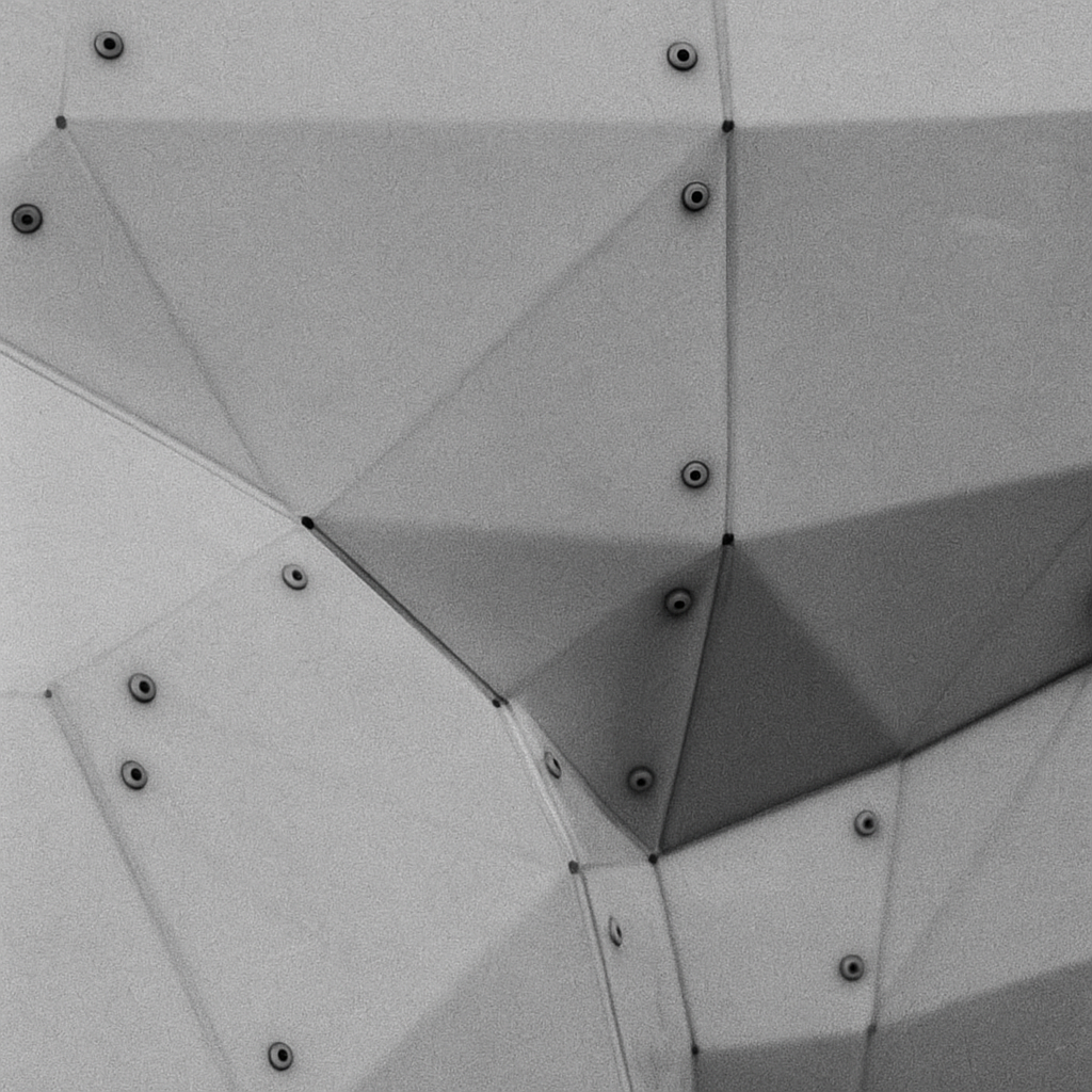 a close up of a metal structure with rivets